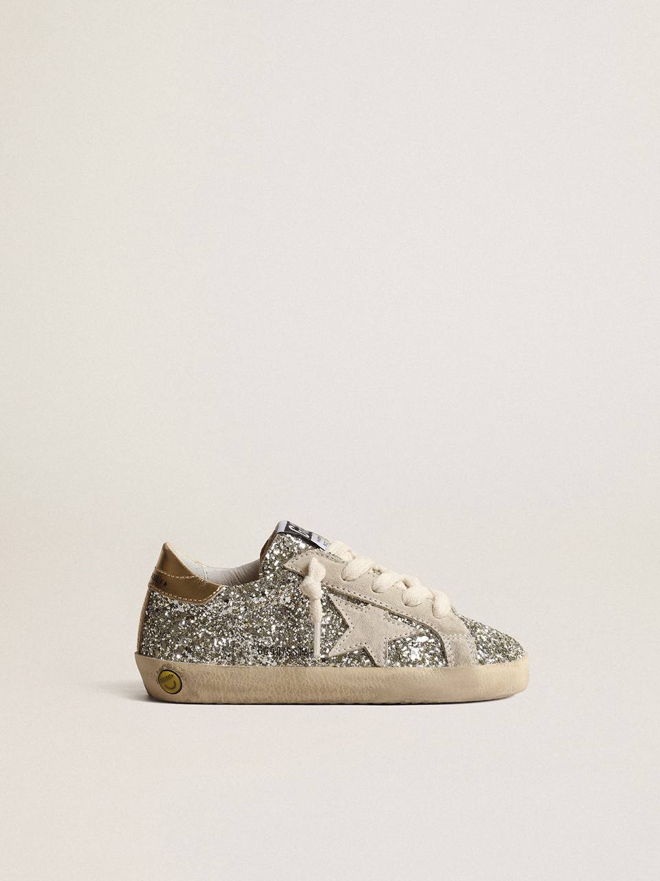 Super-Star Young in glitter with a suede star and gold heel tab