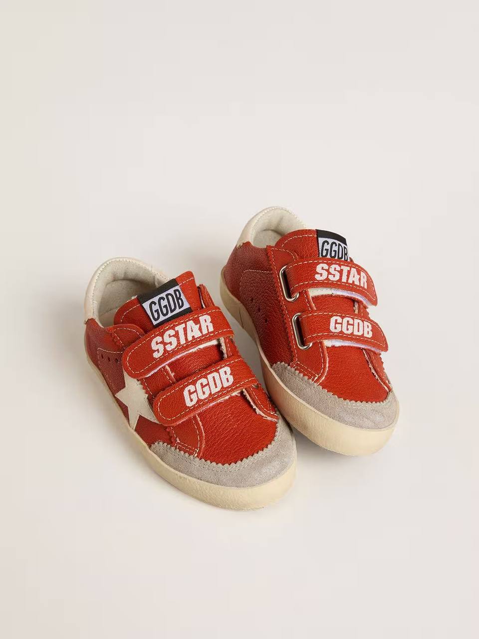 Young Old School in orange nappa with white star and cream-colored leather heel tab