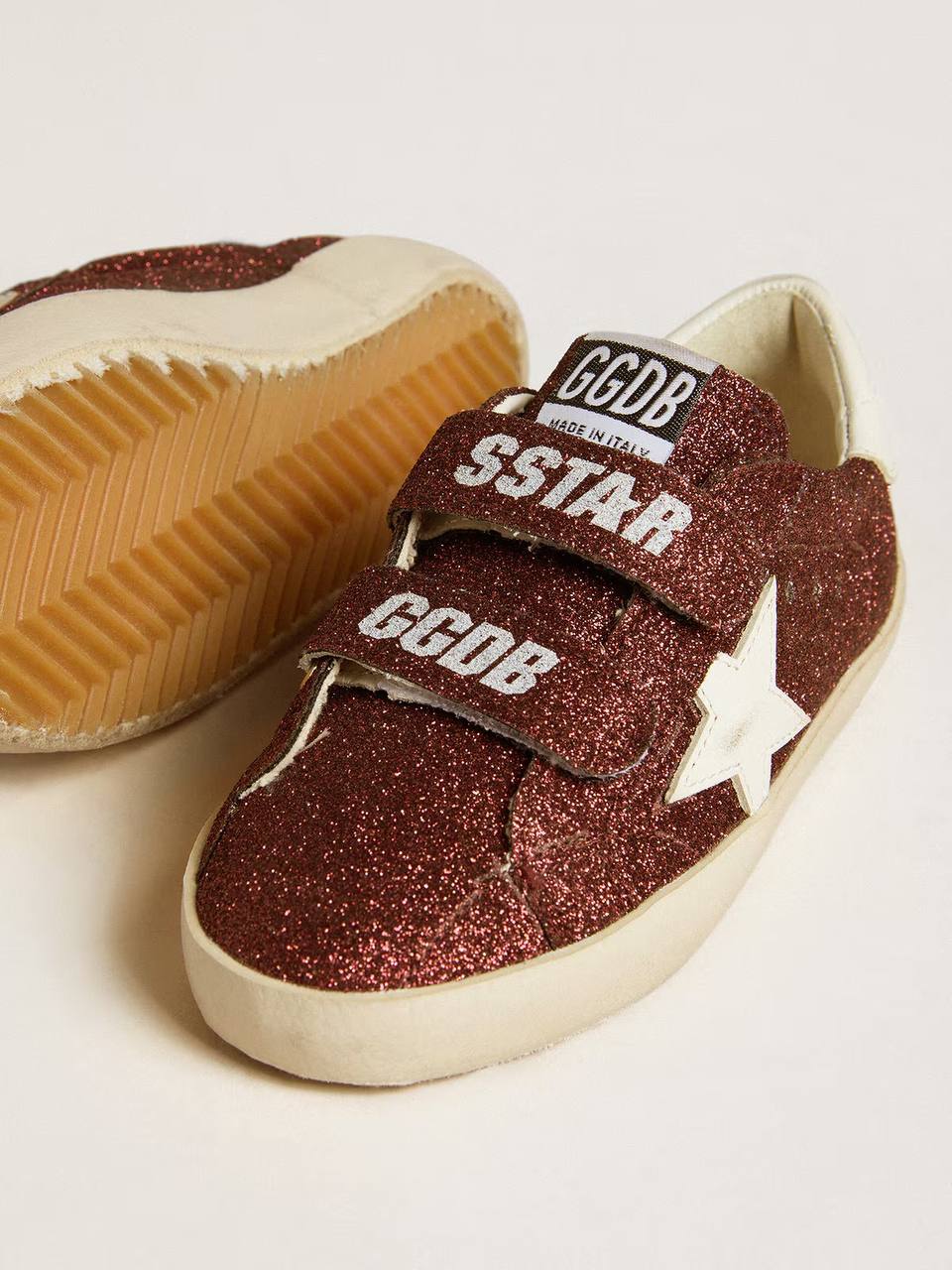 Old School Junior in burgundy glitter with leather star and heel tab