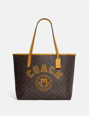 Coach City Tote In Signature Canvas With Varsity Motif In Yellow